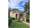 Two-story home with stone accents and landscaped yard at 4759 Lathloa Loop, Lakeland, FL 33811