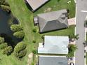 Home's bird's eye view showcasing backyard and pond at 4104 Martindale Loop, Winter Haven, FL 33884