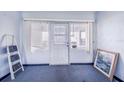 Small room with a door to the outdoors and a framed picture at 605 Florida Ave, Dundee, FL 33838