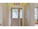 Front door with sidelights and arched window above at 235 Foggy Creek Rd, Davenport, FL 33837