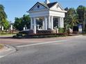 Elegant Providence community entrance featuring a white gazebo with brick signage and lush landscaping at 137 Drayton Ave, Davenport, FL 33837