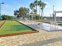 Shuffleboard and bocce ball courts with lake views at 4092 Carteret Dr, Winter Haven, FL 33884