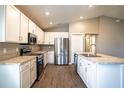 Modern kitchen with white cabinets, stainless steel appliances, and granite countertops at 4364 Reding Way, Lakeland, FL 33813