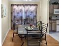 Dining room with a dark wood table and six chairs at 1333 Rebecca Dr, Haines City, FL 33844