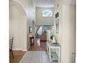 Bright and spacious entryway with high ceilings and hardwood floors at 1333 Rebecca Dr, Haines City, FL 33844