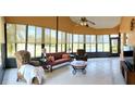 Bright sunroom featuring tile flooring and many large windows, offering views of the outdoors at 4101 Limerick Dr, Lake Wales, FL 33859