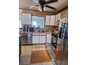 Well-equipped kitchen with stainless steel appliances, tile backsplash, and ample countertop space at 5031 Timberlane Rd, Lake Wales, FL 33898