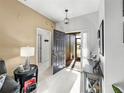Bright and airy foyer with tile floors and access to other rooms at 4076 Tralee Dr, Lake Wales, FL 33859