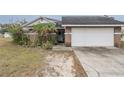 Brick house with attached garage and landscaping at 6102 N Fork Ct, Lakeland, FL 33809