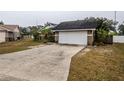 Brick house with attached garage and long driveway at 6102 N Fork Ct, Lakeland, FL 33809