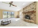 Spacious living room featuring a brick fireplace and large windows at 111 Woden Way, Winter Haven, FL 33884