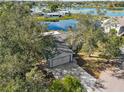 Home nestled amongst trees, near a lake at 1143 Waterview Pt, Lakeland, FL 33801