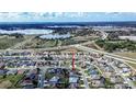 Aerial view of house in residential neighborhood near lake at 1548 Normandy Heights Blvd, Winter Haven, FL 33880
