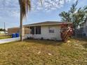 One-story house with a spacious front yard and mature landscaping at 162 N 2Nd St, Eagle Lake, FL 33839