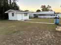 Large backyard with detached shed and grassy area at 1865 4Th Se St, Winter Haven, FL 33880