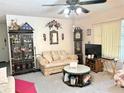 Living room with sofa, coffee table, and TV at 1865 4Th Se St, Winter Haven, FL 33880