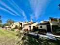 Row of condos with green lawn and walkway at 19 Aspen Dr. # 19, Haines City, FL 33844