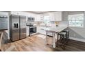 Updated kitchen featuring stainless steel appliances and granite countertops at 2104 John Arthur Way, Lakeland, FL 33803