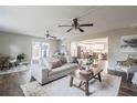 Bright living room with hardwood floors, comfy sofa, and stylish coffee table at 2104 John Arthur Way, Lakeland, FL 33803