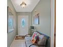 Bright entryway with tiled floor and seating area at 25 Aviation Dr, Winter Haven, FL 33881