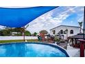 Inviting above-ground pool with a shaded play area at 3001 Crystal Beach Rd, Winter Haven, FL 33880