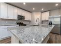 Spacious kitchen with white cabinets and granite countertops at 3285 Weitzel Dr, Haines City, FL 33844