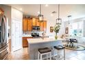 Modern kitchen with island, stainless steel appliances, and light wood cabinets at 4062 Bedford Ave, Winter Haven, FL 33884