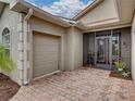 Side entry into garage with paver driveway at 4489 Strathmore Dr, Lake Wales, FL 33859