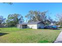 Large backyard with a screened patio and a fenced area at 5090 Misty Lake Dr, Mulberry, FL 33860
