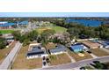 Aerial view showing home's location near a lake and school at 703 Avenue L Se, Winter Haven, FL 33880