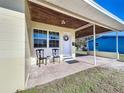 Covered front porch with seating and wreath at 703 Avenue L Se, Winter Haven, FL 33880