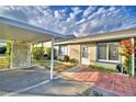 House exterior with carport and small patio at 86 Winter Ridge Rd # 86, Winter Haven, FL 33881
