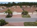Aerial view of a community of villas with brown roofs at 1649 Linz Ct, Winter Haven, FL 33884