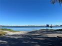 Scenic lake view with boat ramp access on a bright, clear day at 1663 W Lake Cannon Nw Dr, Winter Haven, FL 33881