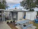 Backyard with shed, picnic table, and grill at 205 Maple W St, Davenport, FL 33837