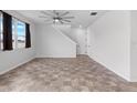 Spacious living room with tile flooring and ceiling fan at 245 Hillcrest Dr, Dundee, FL 33838