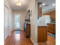 Hardwood floor entryway, with a console table and mirror at 340 Lake Suzanne Dr, Lake Wales, FL 33859