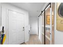 Bright entryway with white doors and glass barn door at 3457 Raleigh Dr, Winter Haven, FL 33884