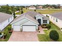 Single-story house with a two-car garage and well-maintained lawn at 3946 Bedford Ave, Winter Haven, FL 33884