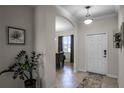 Bright and airy entryway with tile flooring and view to dining area at 3946 Bedford Ave, Winter Haven, FL 33884