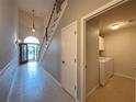 Hallway view of laundry room with washer and dryer at 4193 Limerick Dr, Lake Wales, FL 33859