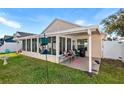 Screened patio with seating area and backyard access at 426 Allison Ave, Davenport, FL 33897