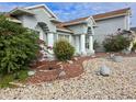 Two-story house with lush landscaping and a light-grey exterior at 437 Grand Reserve Dr, Davenport, FL 33837