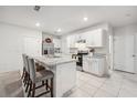 Spacious kitchen with white cabinets and granite countertops at 723 Chinoy Rd, Davenport, FL 33837