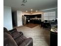 Living room with open concept kitchen and dining area at 932 Grandin St, Davenport, FL 33837