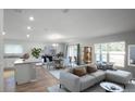 Bright living area with an open floor plan features contemporary furnishings and lots of natural light at 264 Spirit Landings Cir, Winter Haven, FL 33880