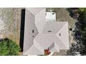 Aerial view of the house showing the roof, yard, patio and surrounding area at 2772 Indian Pipes Trl, Frostproof, FL 33843