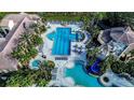 Community pool with lap lanes, leisure pool, and water slide at 3526 Valleyview Dr, Kissimmee, FL 34746