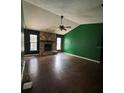 Spacious living room with stone fireplace and views to the outdoors at 3710 Black Jack Ct, Lake Wales, FL 33898