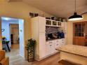 Updated kitchen featuring white cabinets and an island at 4105 Oak Dr, Winter Haven, FL 33881